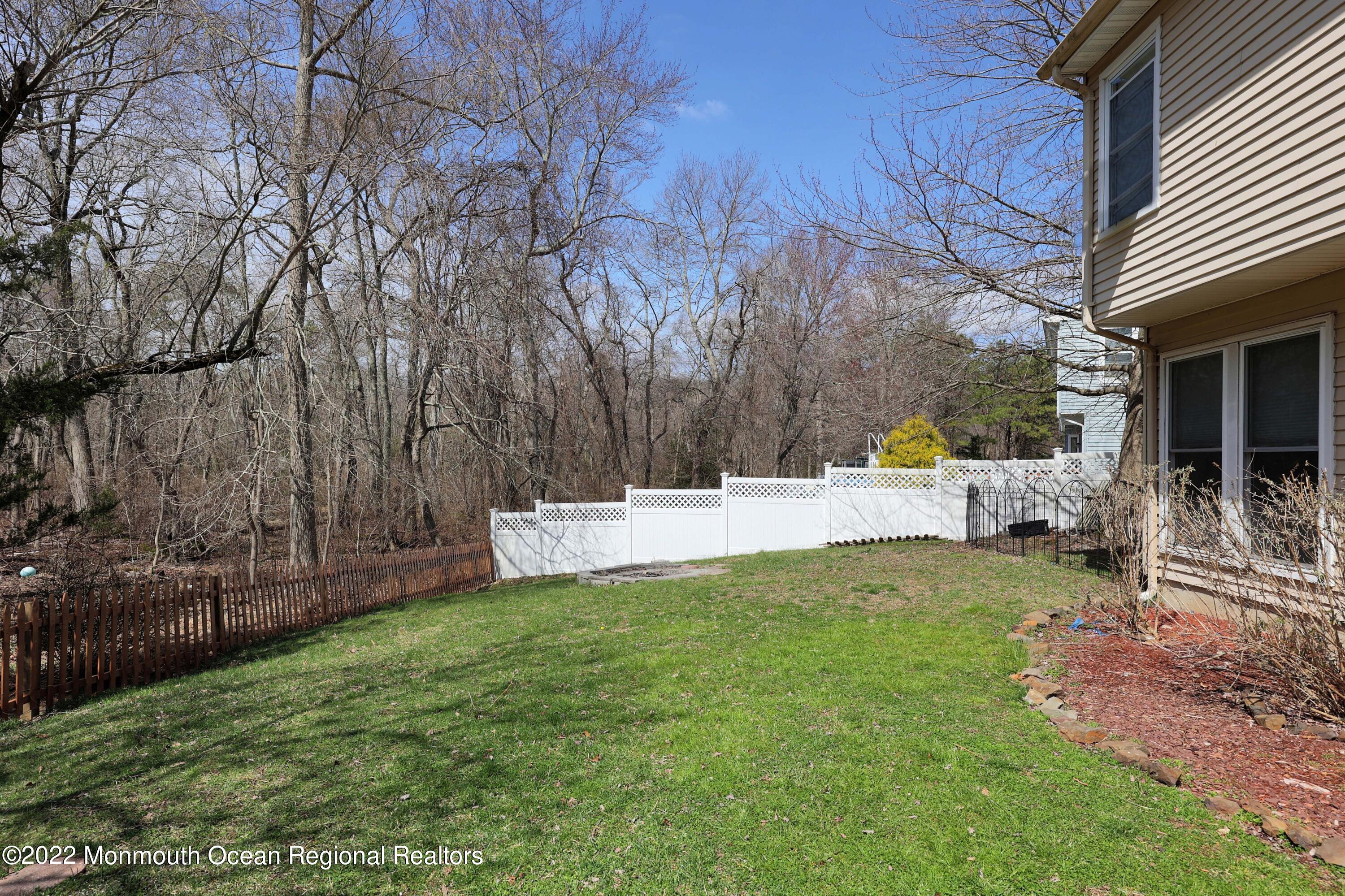 8 Reed Road Howell, NJ 07731 - Photo 20 of 22 a view of a back yard of the house