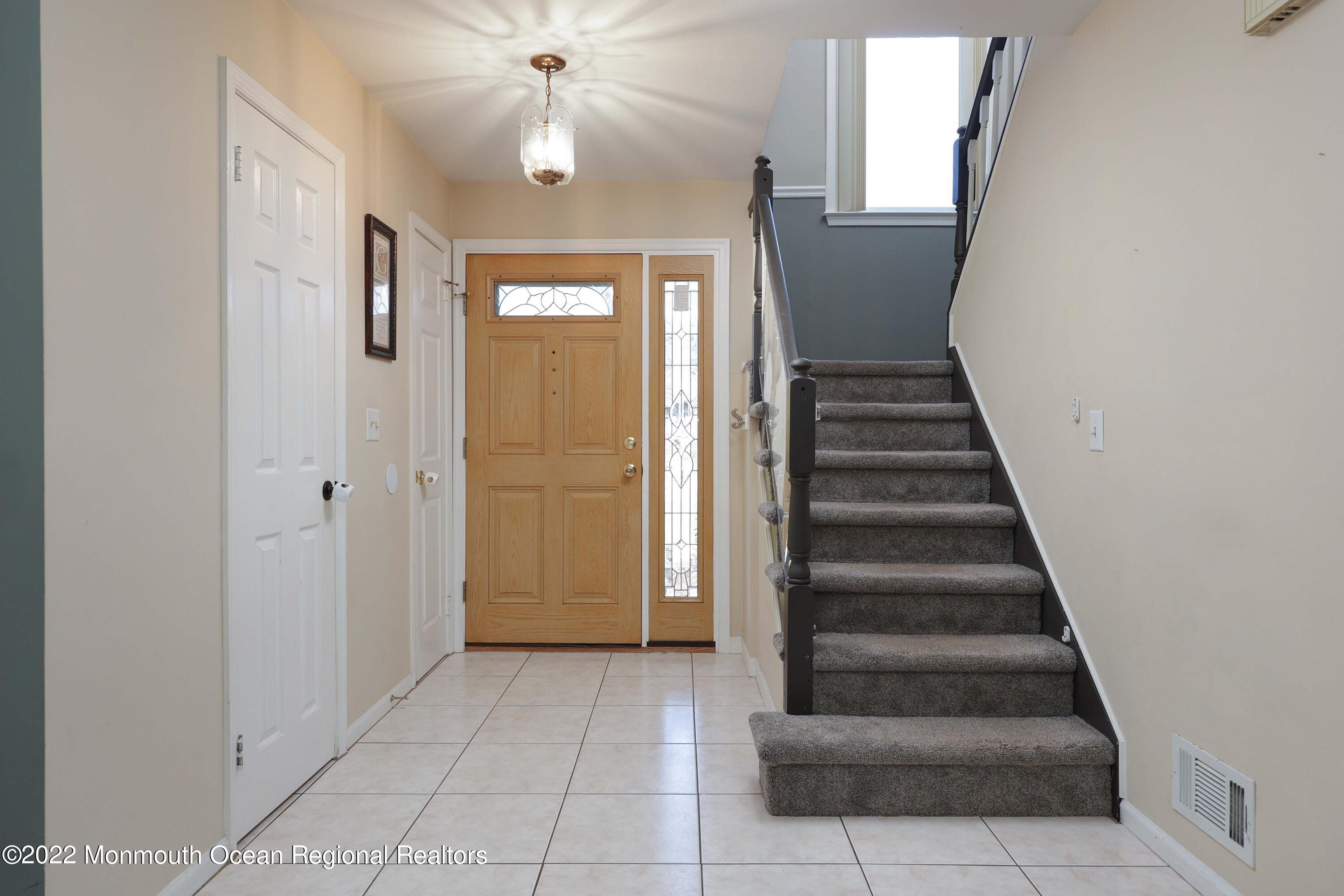 8 Reed Road Howell, NJ 07731 - Photo 4 of 22 a view of entryway and hall with a front door