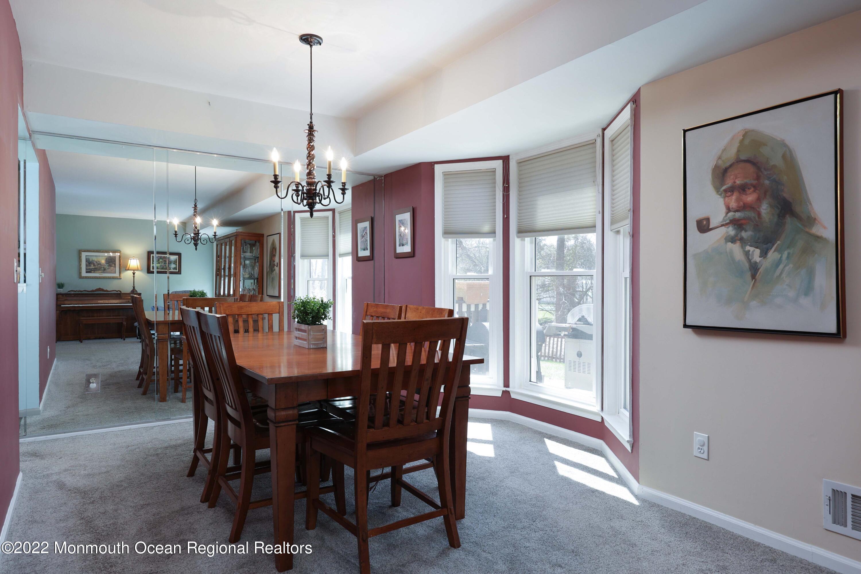 8 Reed Road Howell, NJ 07731 - Photo 8 of 22 a view of a dining room with furniture window and wooden floor