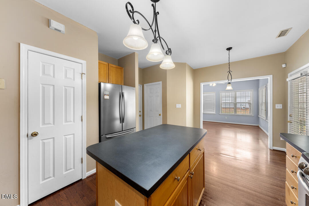 5324 Bartram Place Raleigh, NC 27617 - Photo 12 of 35 a view of a kitchen with furniture and wooden floor