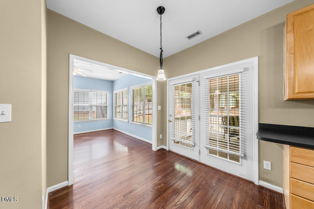 5324 Bartram Place Raleigh, NC 27617 - Photo 16 of 35 a view of a room with wooden floor and windows