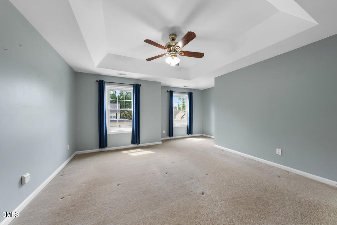 5324 Bartram Place Raleigh, NC 27617 - Photo 20 of 35 a view of an empty room with a window