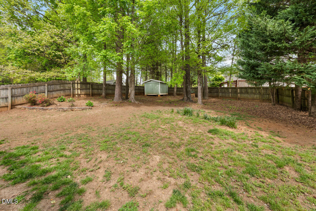 5324 Bartram Place Raleigh, NC 27617 - Photo 31 of 35 a view of a yard with a tree