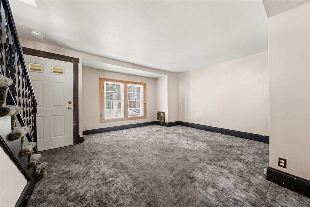 6 Cottage Street Lowell, MA 01852 - Photo 11 of 32 an empty room with windows