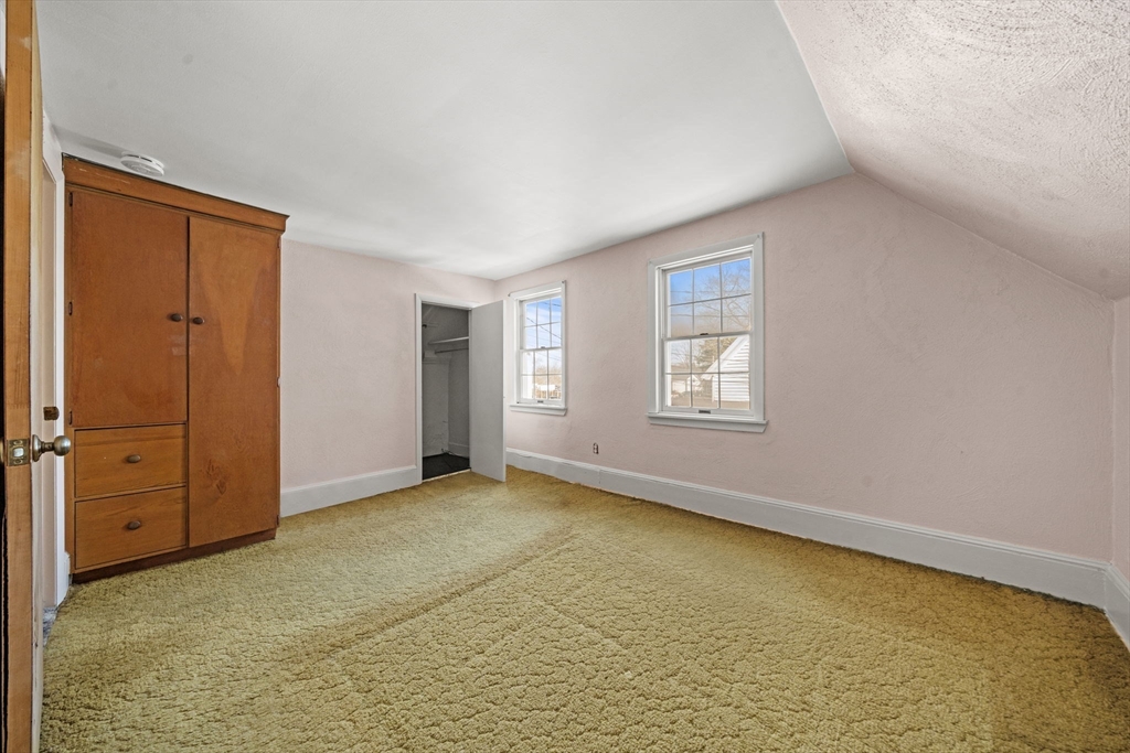 6 Cottage Street Lowell, MA 01852 - Photo 17 of 32 an empty room with windows
