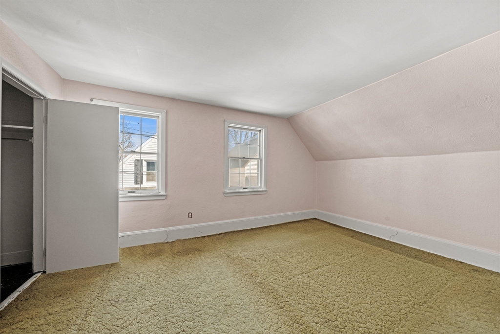 6 Cottage Street Lowell, MA 01852 - Photo 19 of 32 an empty room with windows
