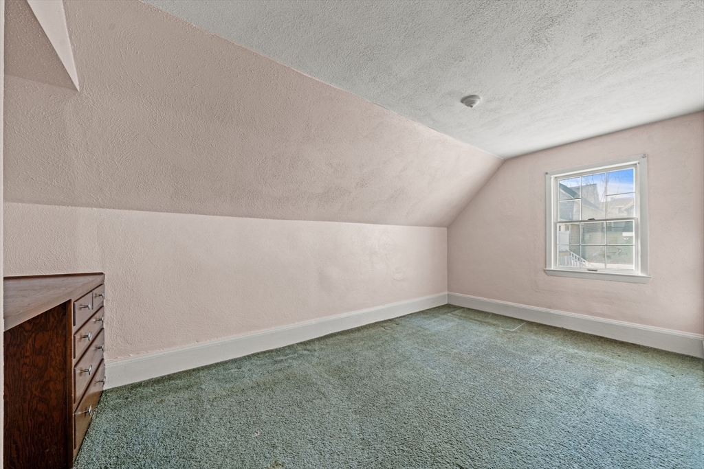 6 Cottage Street Lowell, MA 01852 - Photo 21 of 32 an empty room with windows