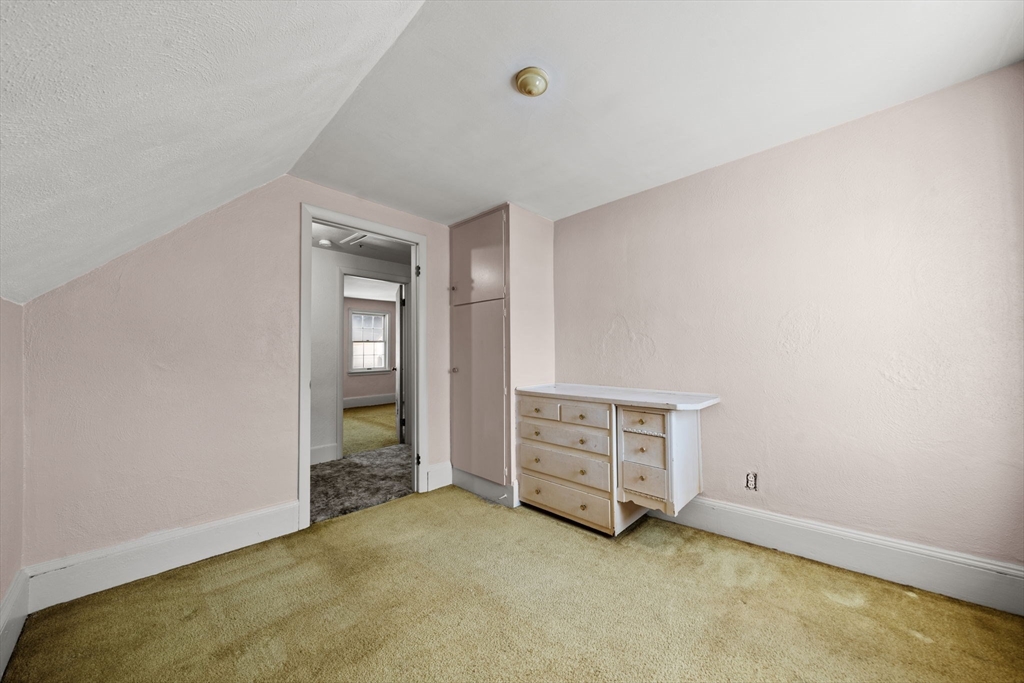 6 Cottage Street Lowell, MA 01852 - Photo 23 of 32 an empty room with furniture and natural light