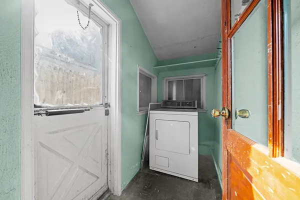 a room that has a bed and a window