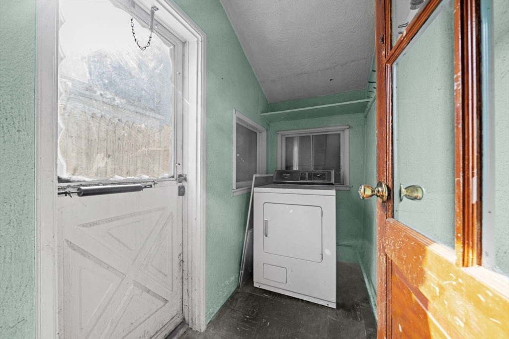 6 Cottage Street Lowell, MA 01852 - Photo 25 of 32 a room that has a bed and a window