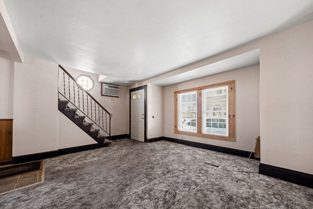 6 Cottage Street Lowell, MA 01852 - Photo 5 of 32 a view of an empty room with a window