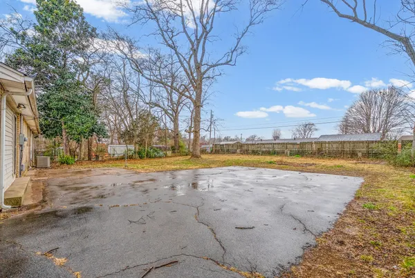 a view of a swimming pool with an outdoor space and seating area