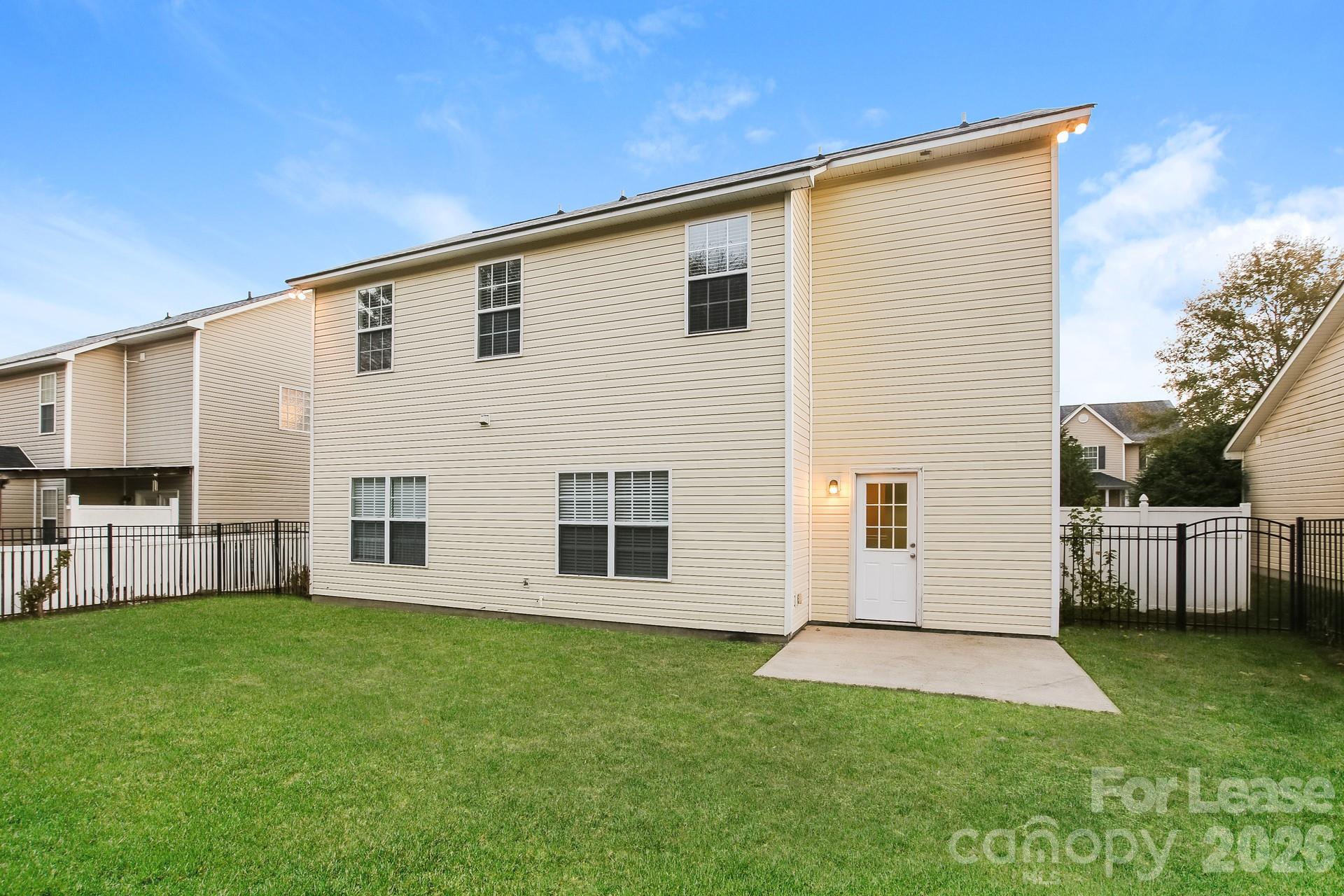 8812 Cornwall Street Locust, NC 28097 - Photo 14 of 15 a view of a house with a backyard