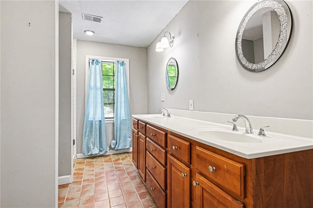 2133 Cooper Way Jonesboro, GA 30236 - Photo 21 of 46 a bathroom with a sink and a mirror