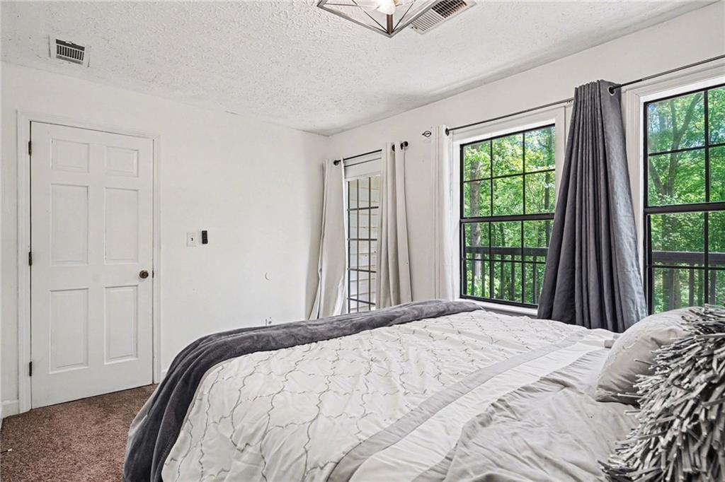 2133 Cooper Way Jonesboro, GA 30236 - Photo 22 of 46 a bedroom with a bed and a window