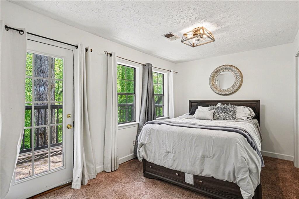 2133 Cooper Way Jonesboro, GA 30236 - Photo 23 of 46 a bedroom with a bed and a window