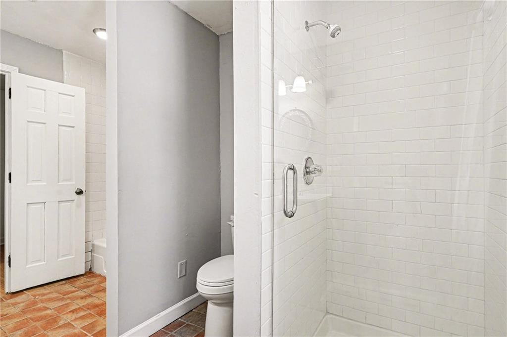 2133 Cooper Way Jonesboro, GA 30236 - Photo 24 of 46 a bathroom with a granite countertop shower and a toilet