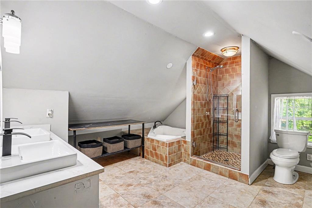 2133 Cooper Way Jonesboro, GA 30236 - Photo 29 of 46 a bathroom with a sink toilet and shower