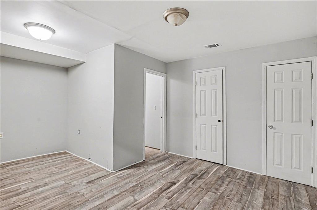 2133 Cooper Way Jonesboro, GA 30236 - Photo 34 of 46 a view of an empty room and wooden floor
