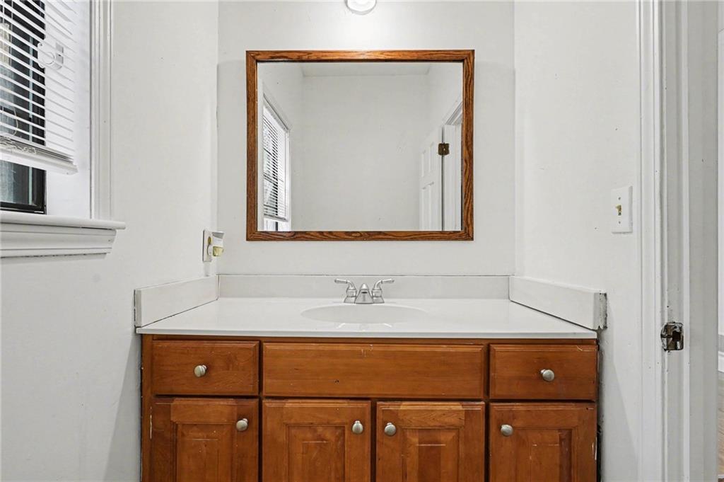 2133 Cooper Way Jonesboro, GA 30236 - Photo 38 of 46 a bathroom with a sink and a mirror