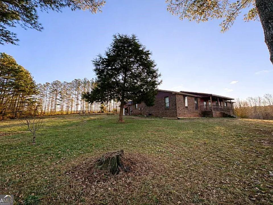 781 Thomas Street Roopville, GA 30170 - Photo 2 of 14 a view of a house with a yard
