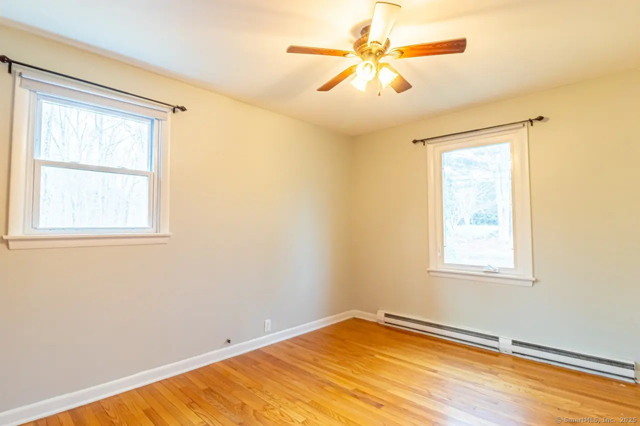405 Noank Ledyard Road Groton, CT 06355 - Photo 12 of 17 a view of an empty room and window