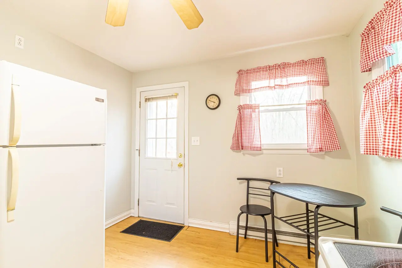 405 Noank Ledyard Road Groton, CT 06355 - Photo 7 of 17 a view of a livingroom with furniture and windows