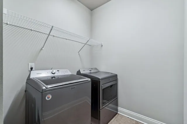 a utility room with dryer and washer