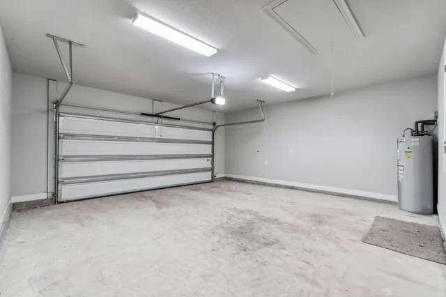 a backyard of a house with plants and outdoor seating