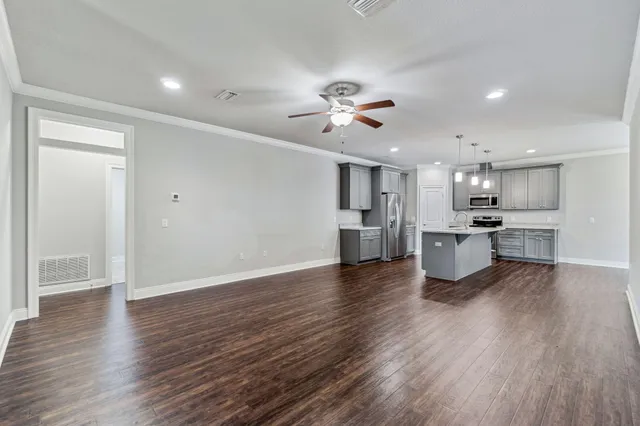 a view of kitchen with wooden floor and window