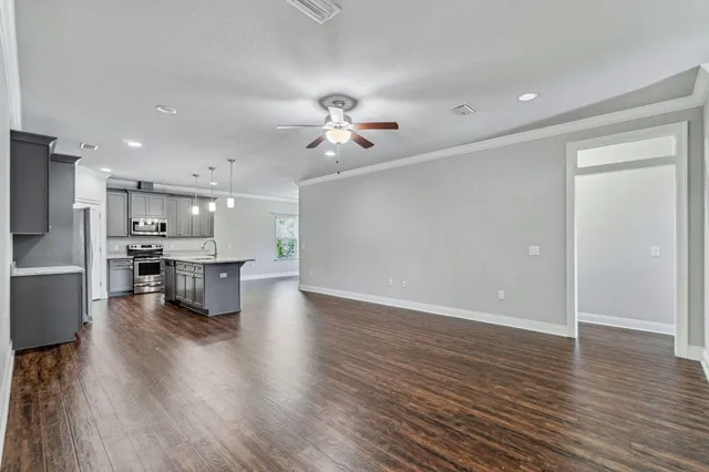 a view of kitchen with cabinets and wooden floor