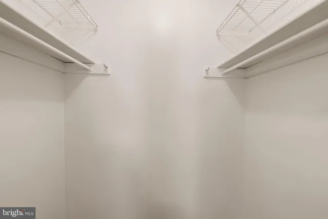 a bathroom with a granite countertop toilet sink and mirror
