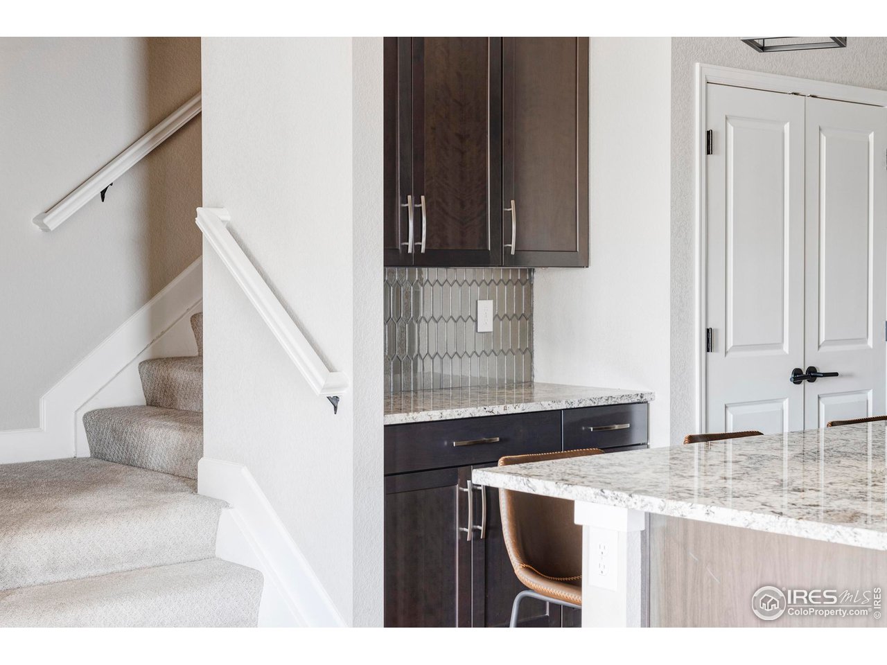 784 Stonebridge Drive Longmont, CO 80503 - Photo 14 of 35 a view of living room with granite countertop furniture and a sink