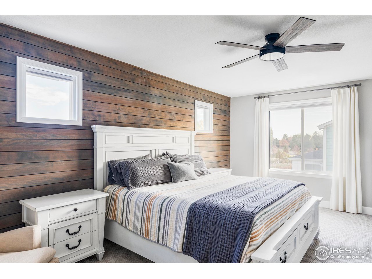 784 Stonebridge Drive Longmont, CO 80503 - Photo 15 of 35 a bedroom with a bed and a window