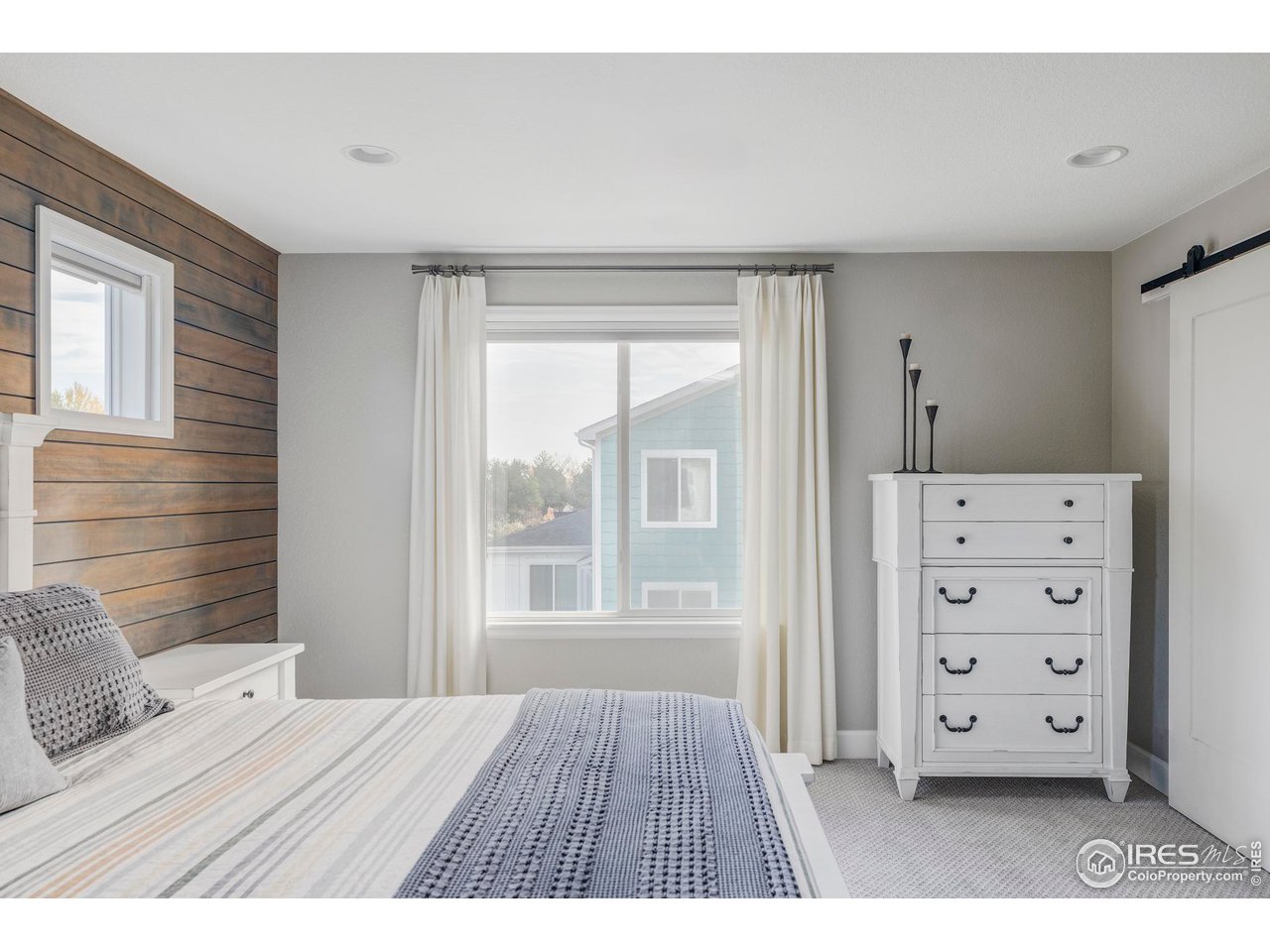 784 Stonebridge Drive Longmont, CO 80503 - Photo 17 of 35 a bedroom with a bed and a dresser