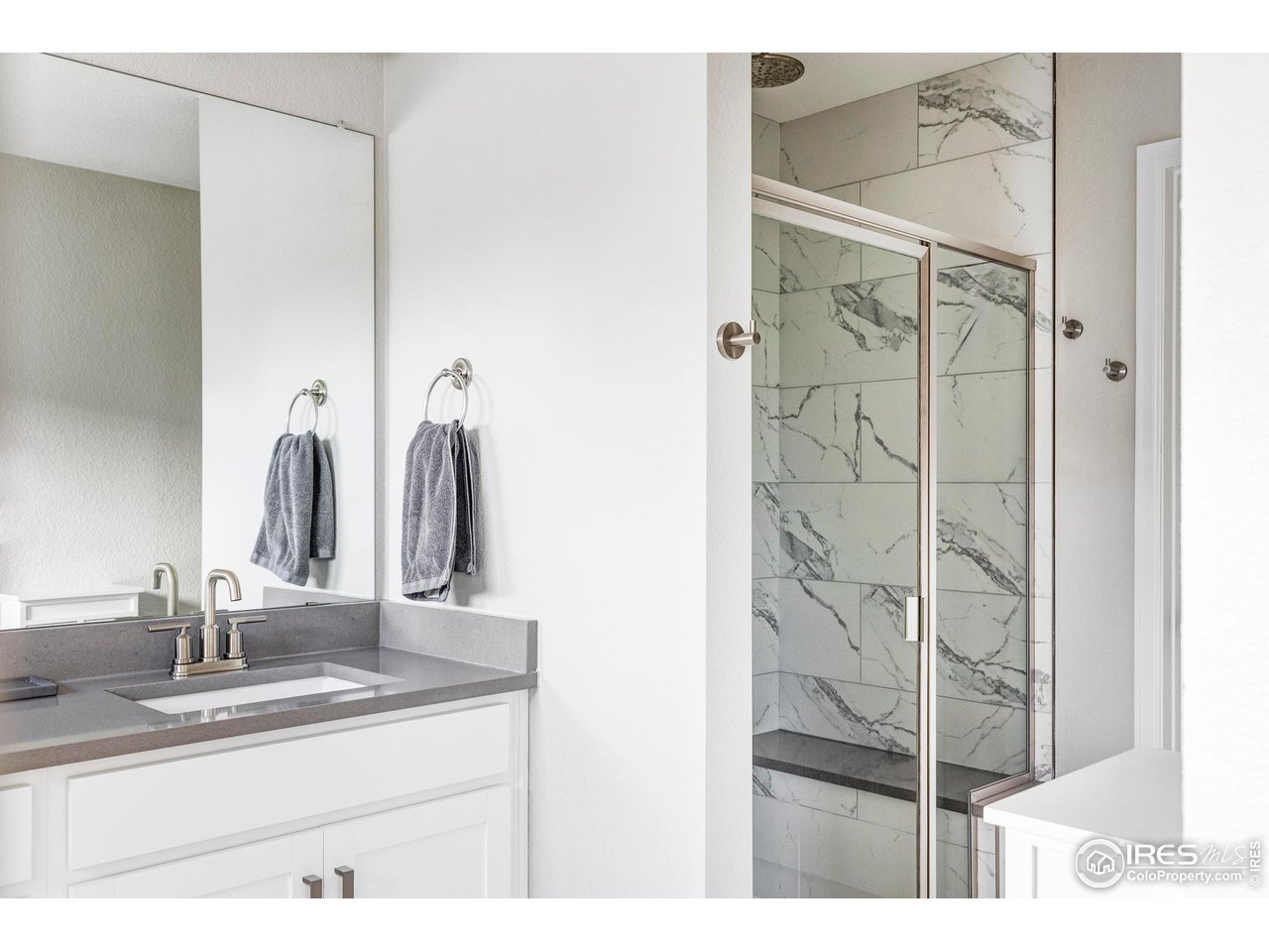 784 Stonebridge Drive Longmont, CO 80503 - Photo 20 of 35 a bathroom with a sink and a mirror