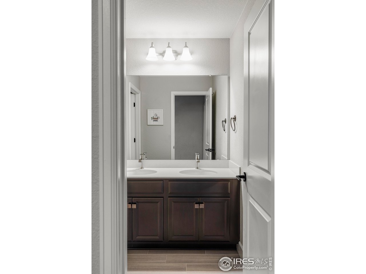784 Stonebridge Drive Longmont, CO 80503 - Photo 24 of 35 a bathroom with a granite countertop sink and a mirror