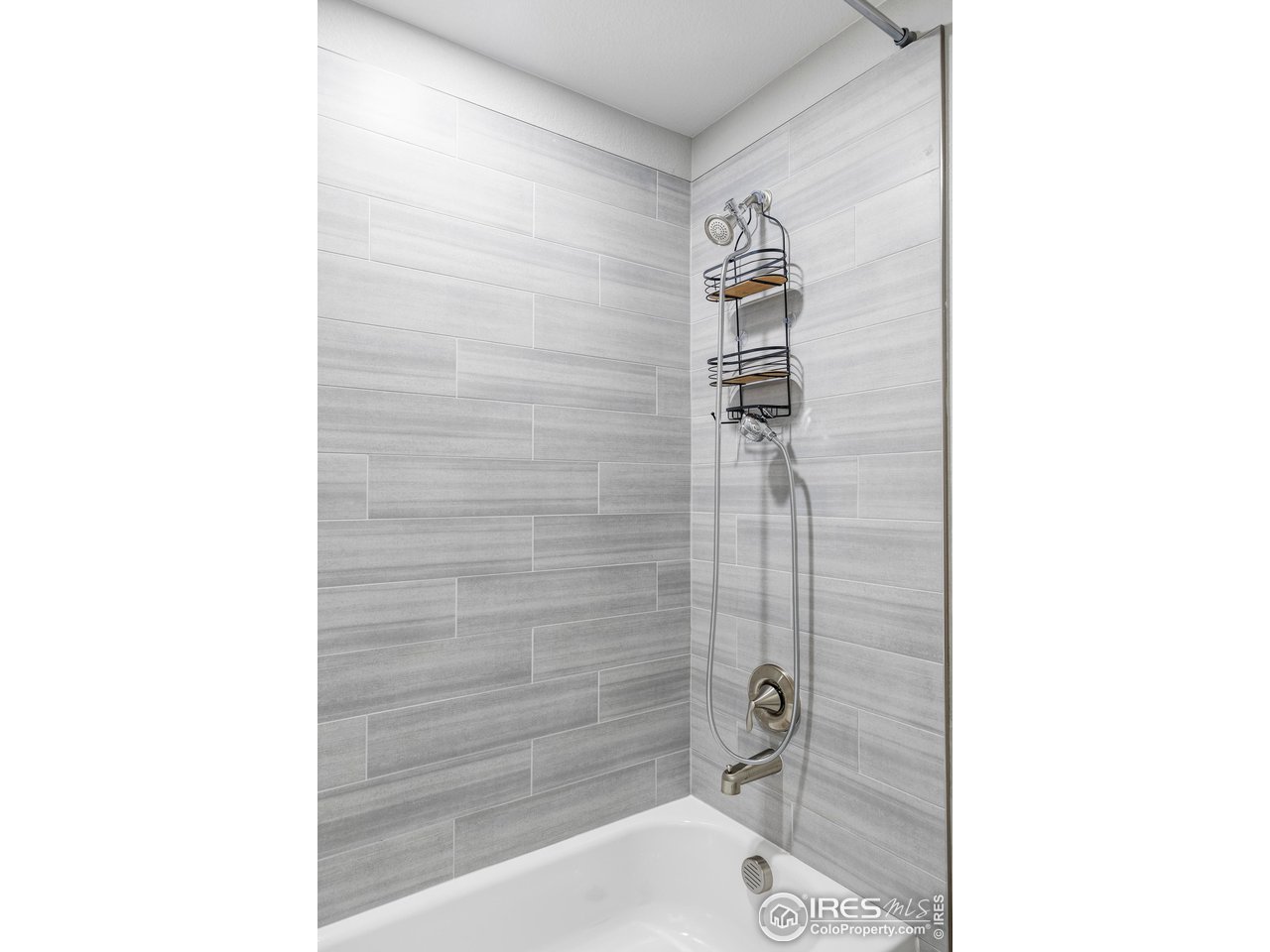 784 Stonebridge Drive Longmont, CO 80503 - Photo 25 of 35 a bathroom with a shower and a sink