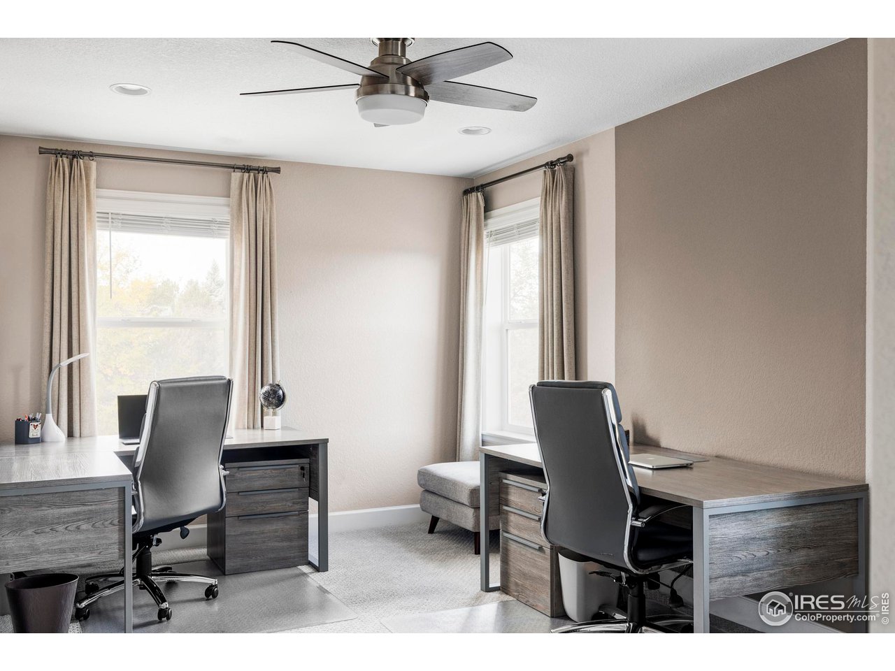 784 Stonebridge Drive Longmont, CO 80503 - Photo 26 of 35 a workspace with furniture and a window