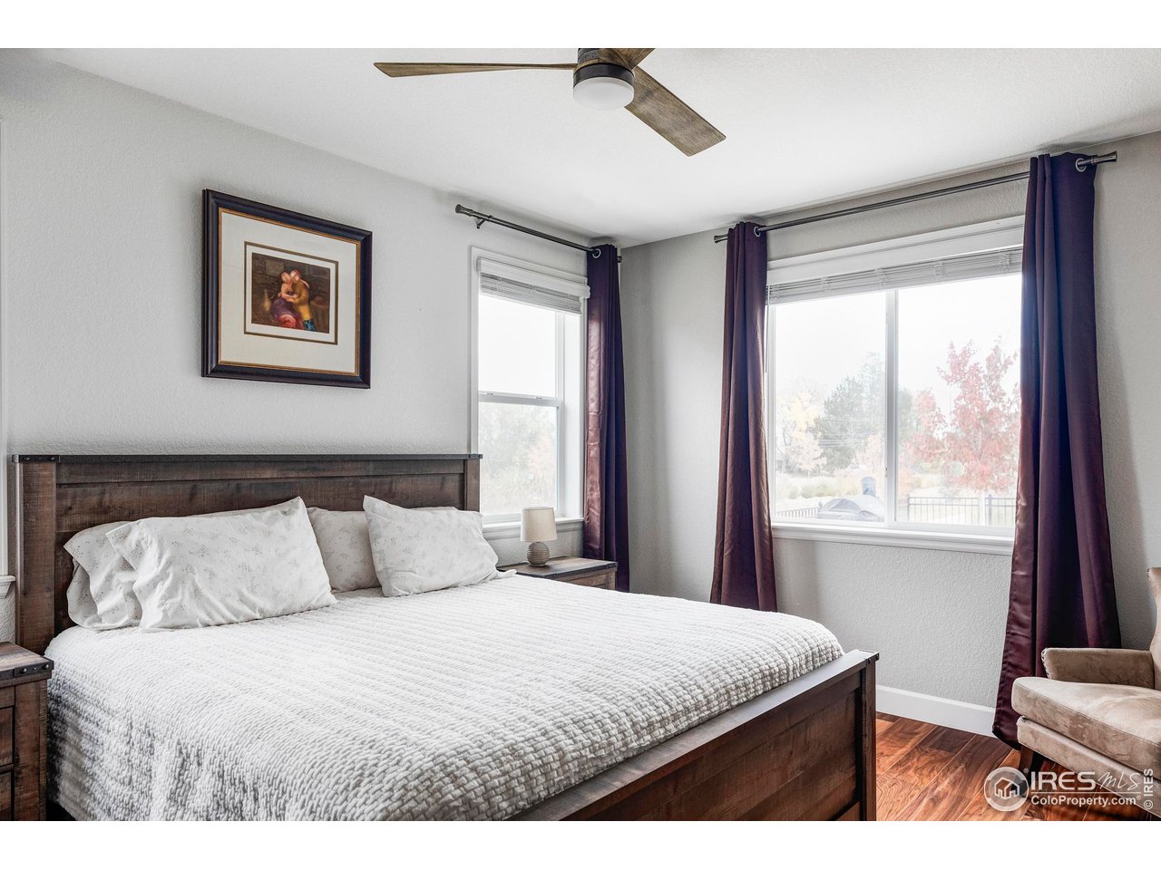 784 Stonebridge Drive Longmont, CO 80503 - Photo 27 of 35 a bedroom with a large bed and a window