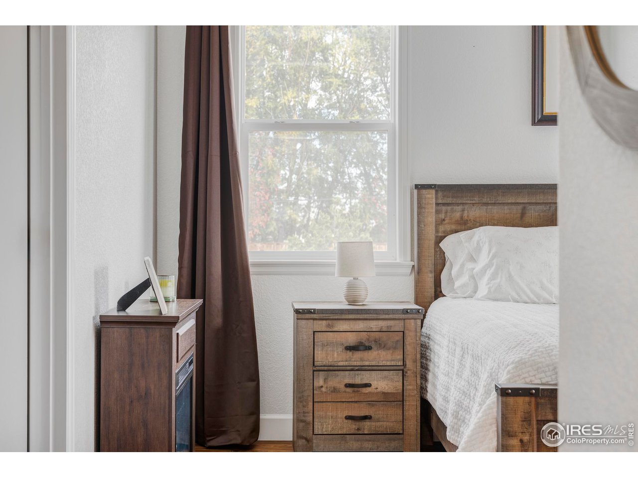 784 Stonebridge Drive Longmont, CO 80503 - Photo 29 of 35 a bedroom with a bed and a window