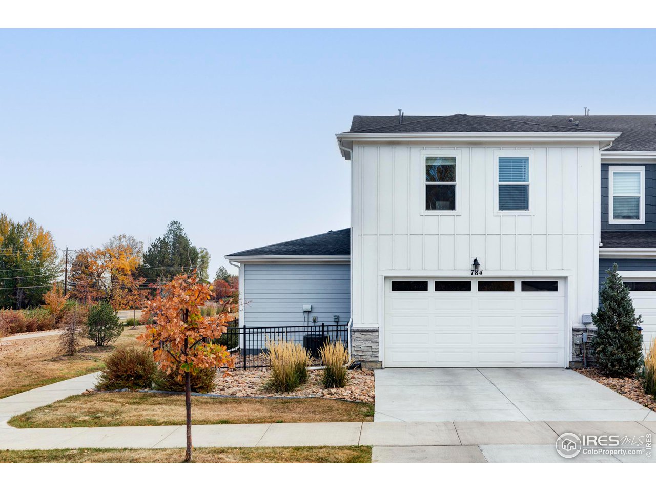 784 Stonebridge Drive Longmont, CO 80503 - Photo 33 of 35 a view of a house with a backyard