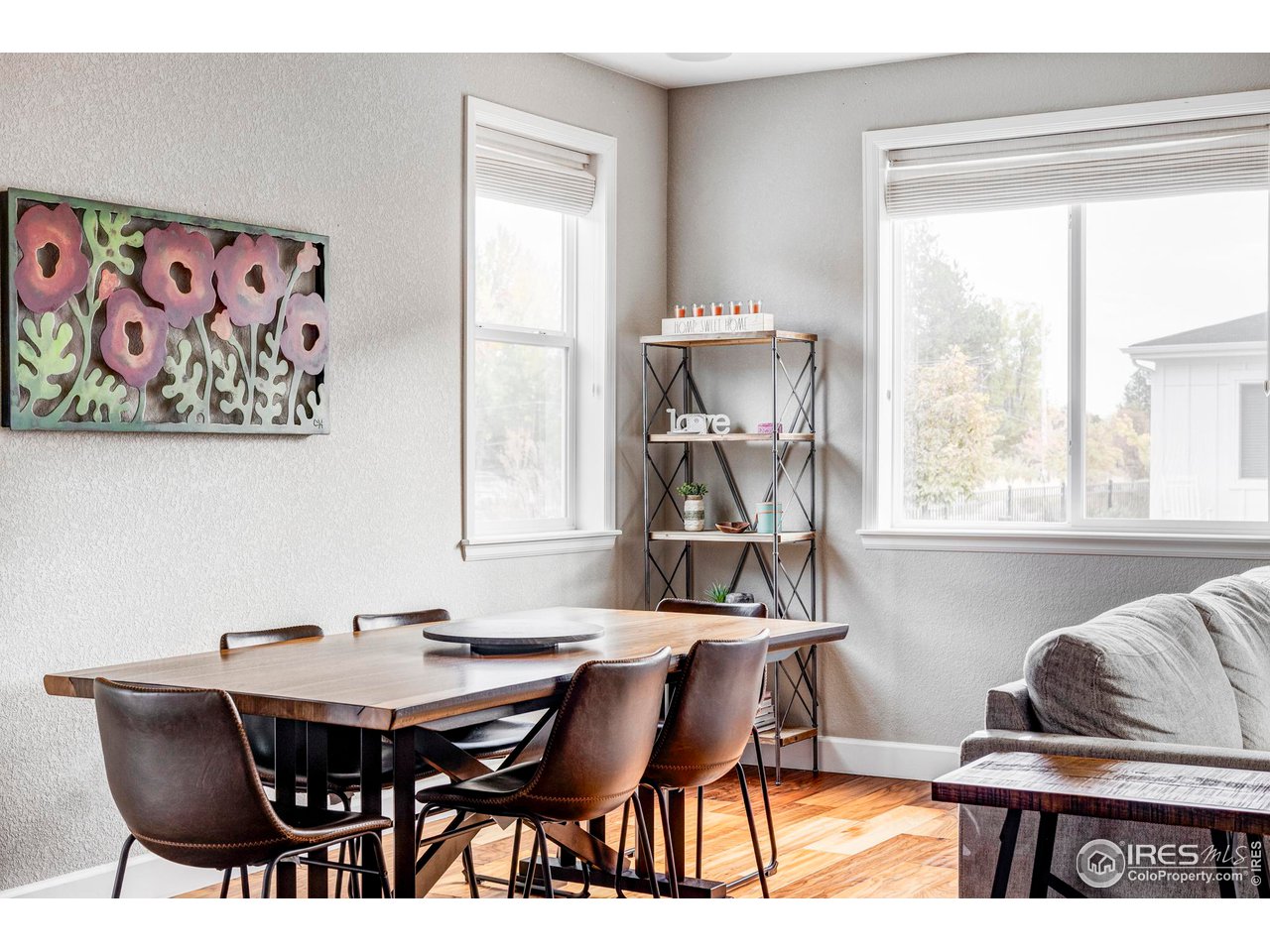 784 Stonebridge Drive Longmont, CO 80503 - Photo 6 of 35 a view of a dining room with furniture and a large window