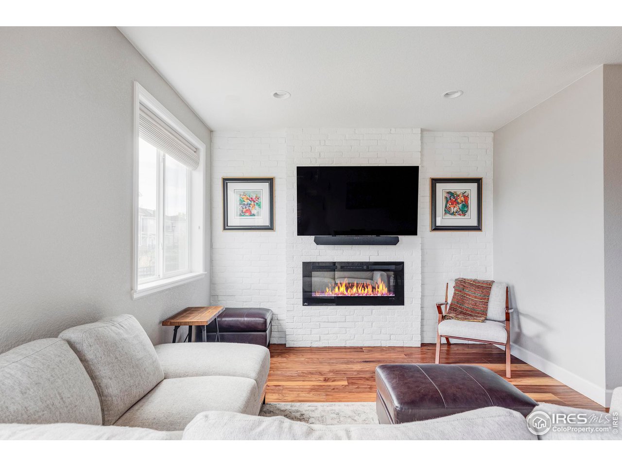 784 Stonebridge Drive Longmont, CO 80503 - Photo 8 of 35 a living room with furniture and a flat screen tv
