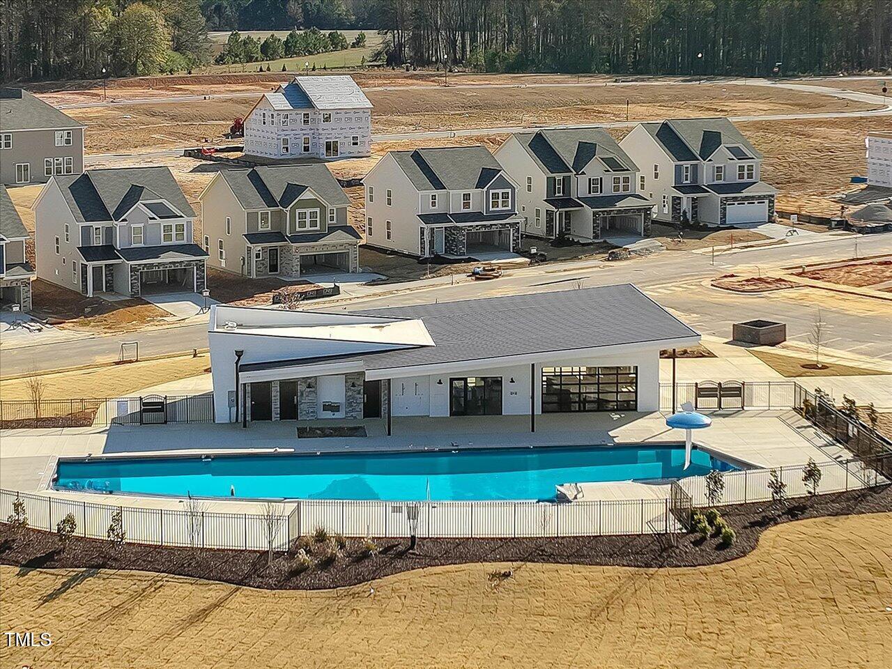 1099 Channel Drop Loop Zebulon, NC 27597 - Photo 14 of 24 an aerial view of a house with swimming pool and a yard
