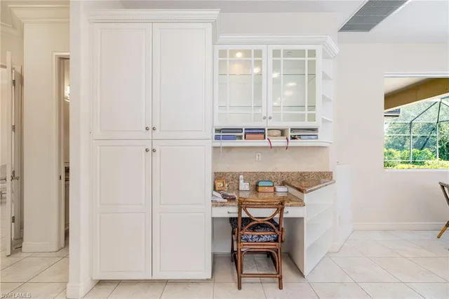 a room with a table and chairs