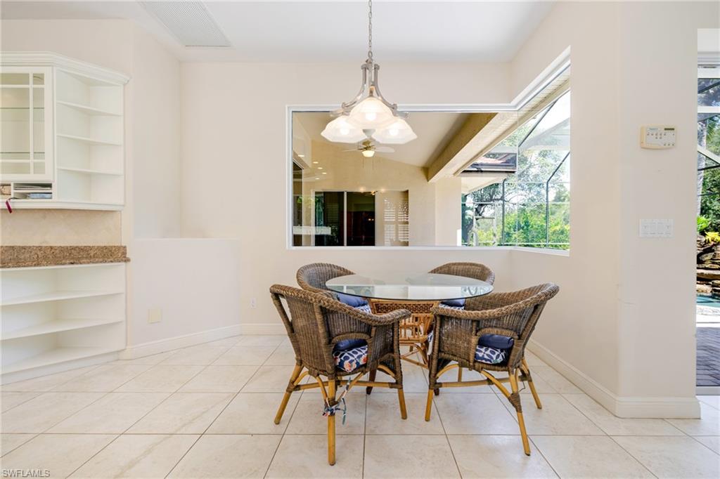 20481 Chapel Trace Estero, FL 33928 - Photo 13 of 50 a view of a dining room with furniture and window