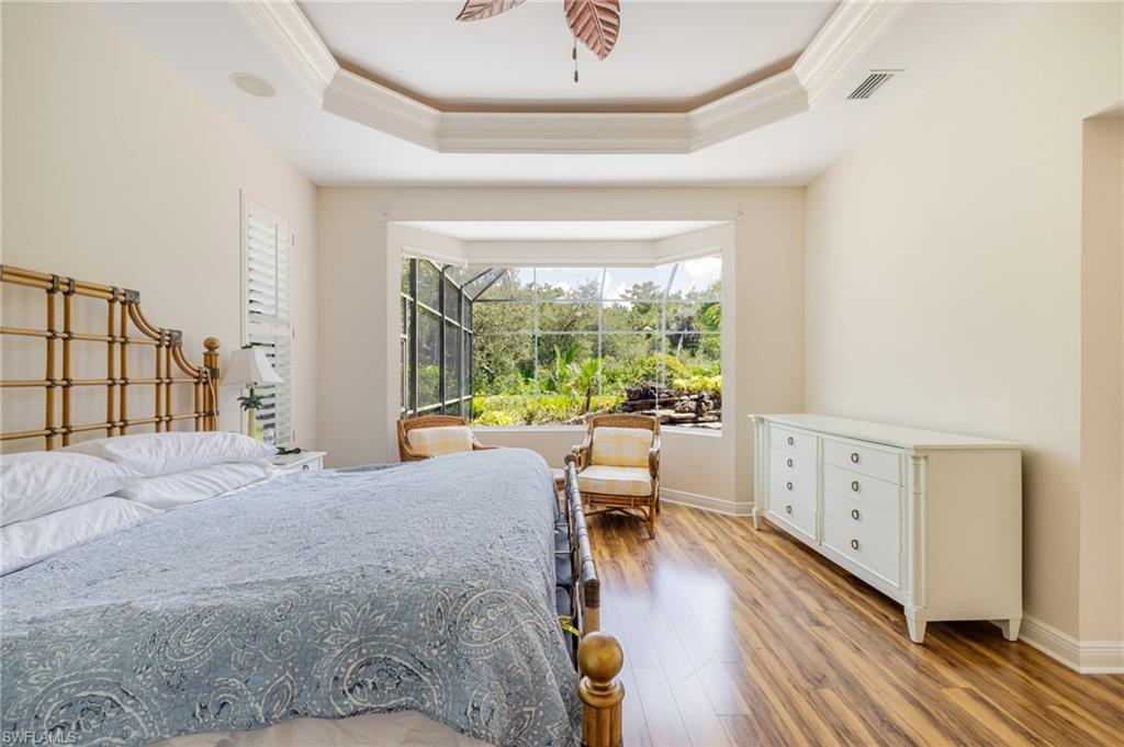 20481 Chapel Trace Estero, FL 33928 - Photo 18 of 50 a bed room with a bed and a large window