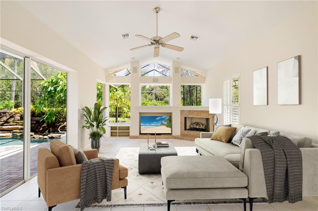 20481 Chapel Trace Estero, FL 33928 - Photo 2 of 50 a living room with furniture fireplace and large windows