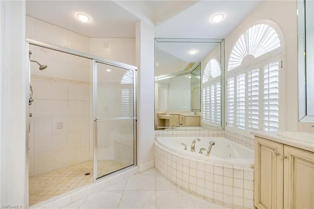 a bathroom with a bathtub and a shower